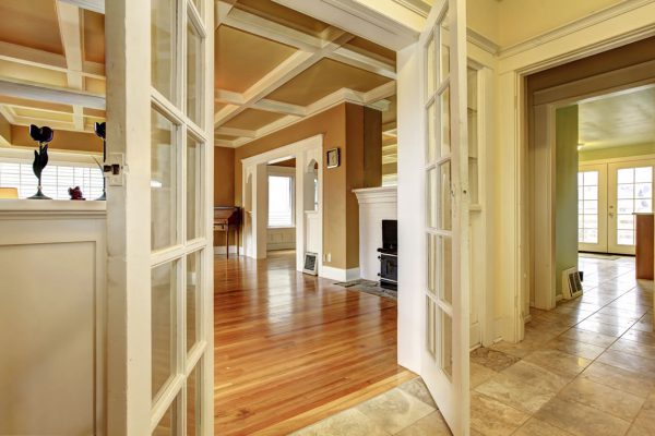 Elegant hallway with wooden floors and decorative ceiling design