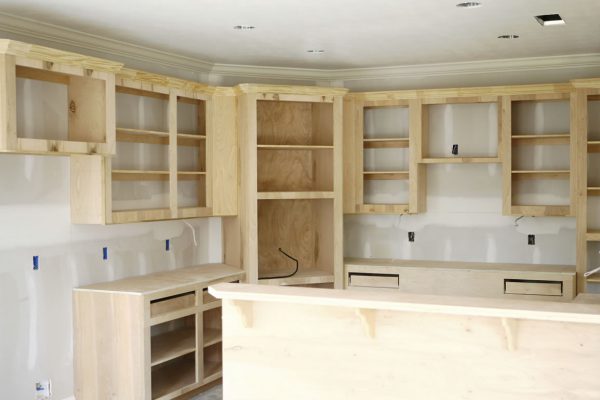Unfinished custom cabinets installed in a new kitchen