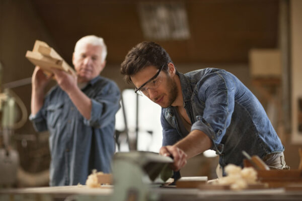 Two men woodworking in a professional carpentry shop