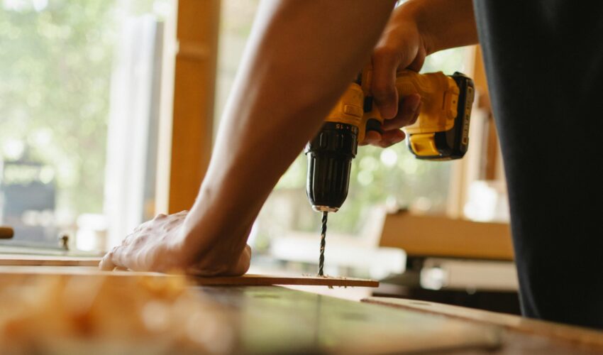 Tools and home repair setup showing the difference between DIY tasks and hiring a Dubai handyman.