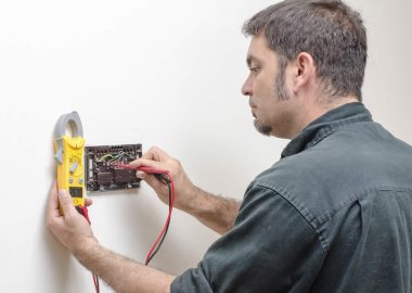 project10 Man repairing a bathroom sink faucet with tools